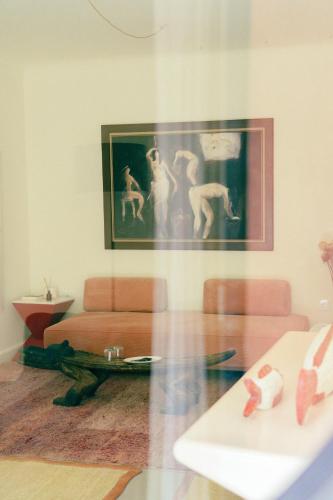 a living room with a glass table and a couch at MORO Marrakech Boutique Hôtel in Marrakech