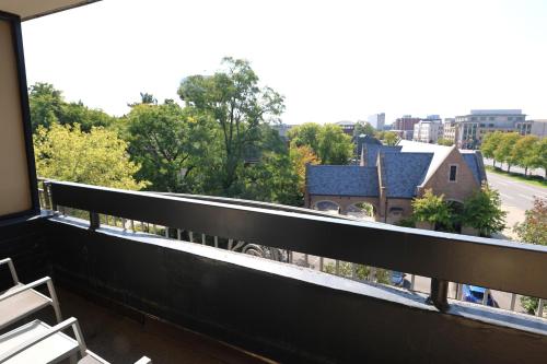 a balcony with chairs and a view of a street at Holiday Inn Express Detroit-Birmingham by IHG in Birmingham