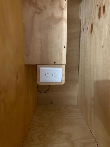 a small bathroom with a heater and a wall at The Boat House Cancun in Cancún