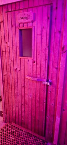 a pink door with a sign that says something on it at Apartment Weiherwiese in Zweibrücken