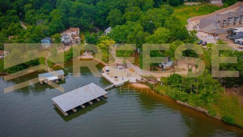 an aerial view of a house on an island in the water at Beach Cabin #5 in Lake Ozark