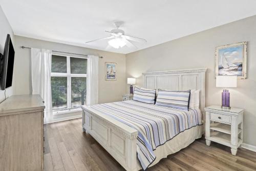 a bedroom with a bed and a ceiling fan at 7484 Anchorage Villa in Hilton Head Island