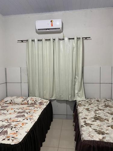 En eller flere senge i et værelse på SA Temporadas