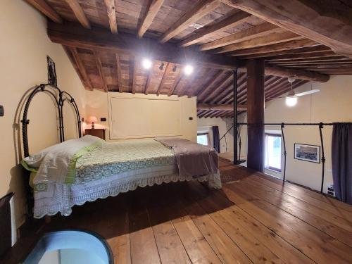 Postel nebo postele na pokoji v ubytování La Capanna di Poggio al Lupo