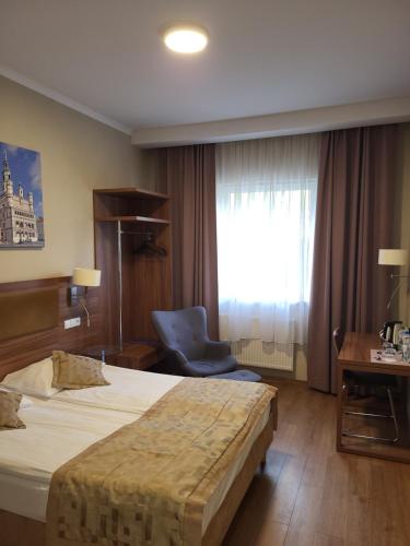 Letto o letti in una camera di Hotel Topaz Poznań Centrum