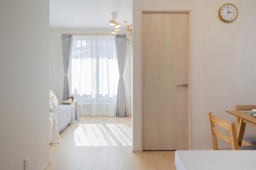 a room with a door leading to a bedroom at Magazine Home Tokyo Spacious 93 3BR Skytree7 minutesAsakusa12 minutes by train in Tokyo