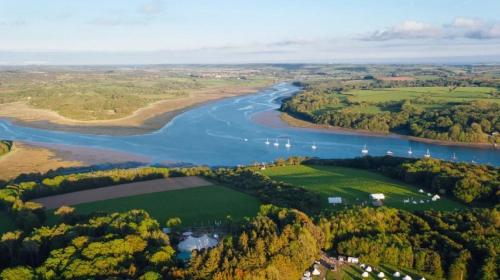 an aerial view of a river and forests at Best Western Lamphey Court Hotel and Spa in Lamphey