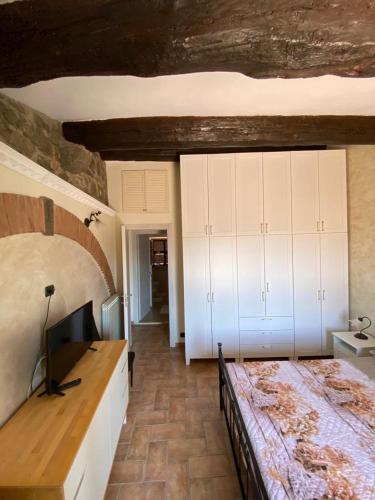 a bedroom with a bed and white cabinets at Center Ariccia in Ariccia
