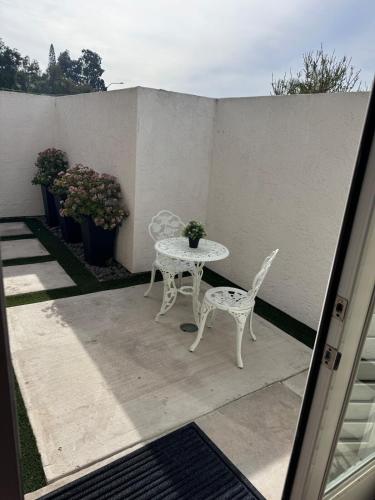 a patio with a table and two chairs and a table at Studio in peaceful gated Single Family Resident community in Laguna Niguel
