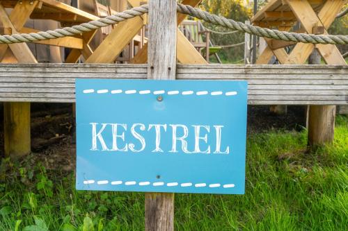 a blue kept sign on a wooden fence at Kestrel - Sweffling Hall in Rendham