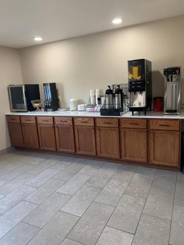 a counter in a room with coffee makers on it at Super 8 by Wyndham Phillips in Phillips