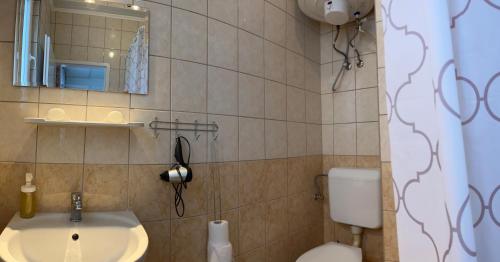 Ein Badezimmer in der Unterkunft Bangó Vendégház