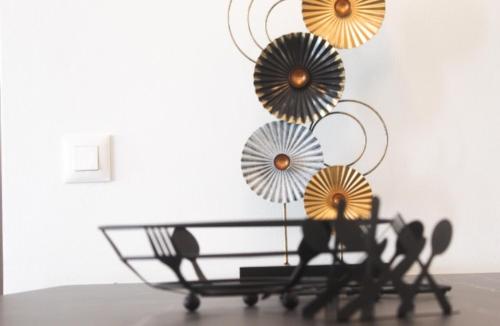 a table with three umbrellas on top of it at Luxury apartment Reverie in Áyios Yeóryios