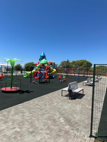 a park with a playground with a slide at Atlantis resort, Issyk-kul in Chon-Sary-Oy