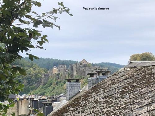 a view of the castle from the roofs of buildings at L'évasion in Bouillon