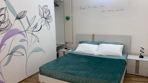 Ένα ή περισσότερα κρεβάτια σε δωμάτιο στο Lulu's Dream Alloggio Turistico