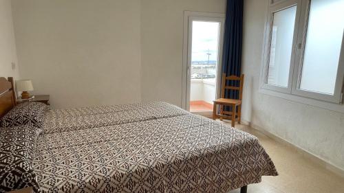 Ένα ή περισσότερα κρεβάτια σε δωμάτιο στο Marina 2-A