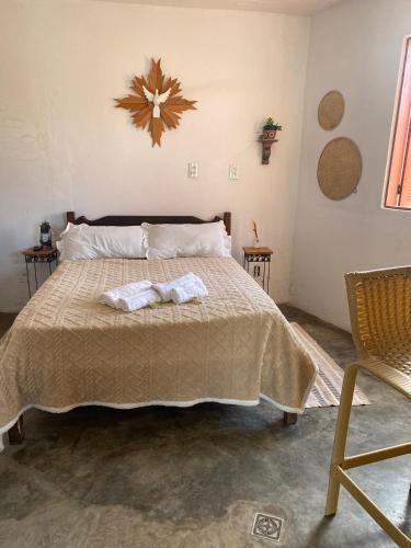 Postel nebo postele na pokoji v ubytování Mini casa Tiradentes