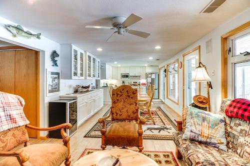 a living room with a couch and chairs at Dock, Deck and Fire Pit Lakefront Home in Walker! in Walker