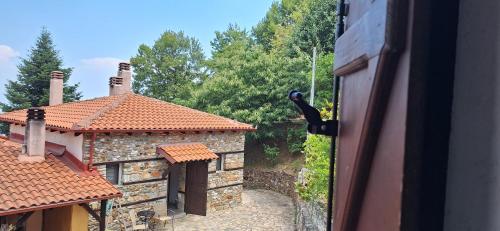 a view from a window of a building with a yard at Kastania Gi in Palaios Panteleimon