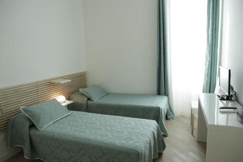 Кровать или кровати в номере B&B Roma Olimpic
