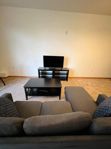 a living room with a couch and a piano at Studio 104 at Foxboro in Oregon