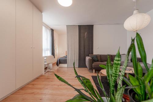 a living room with a couch and a table at Bastion New Apartment with Parking in Košice