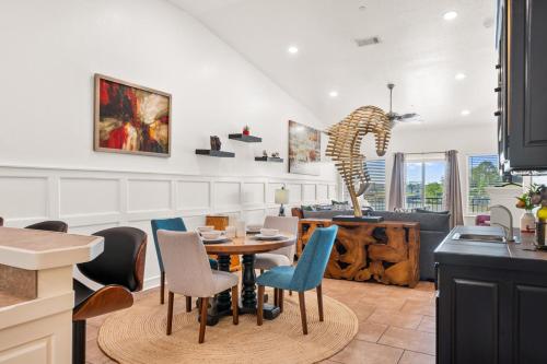 a kitchen and living room with a table and chairs at The Oasis on Lake Hamilton with Pool in Hot Springs