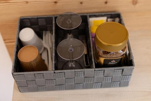 a basket filled with various items on a table at SAN PIETRO DOLOMITI Small Budget Hotel in Ortisei