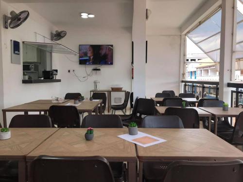 TV a/nebo společenská místnost v ubytování Motel Tartaruga
