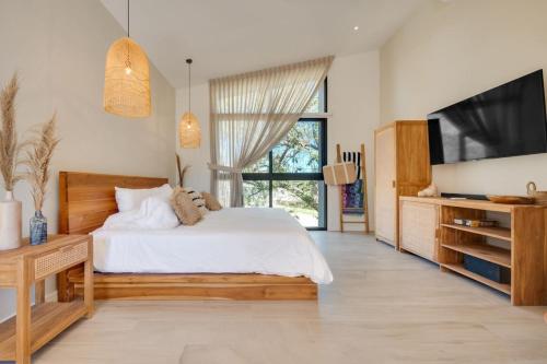 Letto o letti in una camera di The Bungalows #10 - Boutique Hotel in Flamingo Beach - Top Level Studio