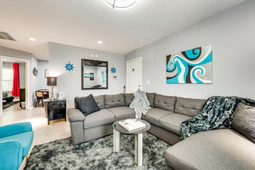 a living room with a couch and a table at Outdoor Entertainment Area Family Concord Apt! in Concord