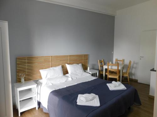 a bedroom with a large bed with two towels on it at B&B Med - Finestra sul Mare in Contrada Mastrissa
