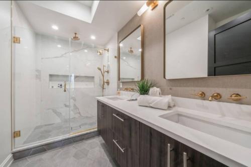 a bathroom with a large sink and a shower at Chic Luxury 4BR Townhome with NYC Views in North Bergen