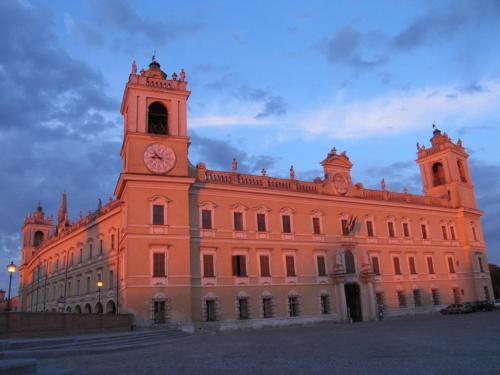 a building with a clock tower on top of it at La Meridiana Affittacamere in Colorno
