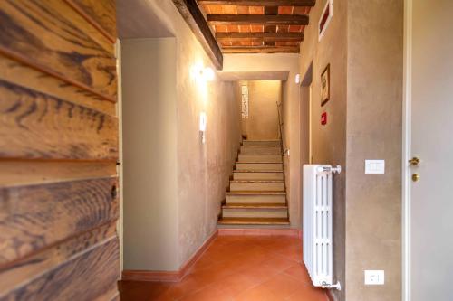 a hallway with stairs in a house at Pio Bove Rooms in Pietrasanta