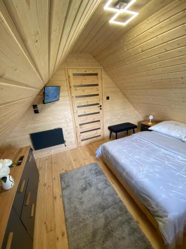 Postel nebo postele na pokoji v ubytování Domek letniskowy Zacisze 2