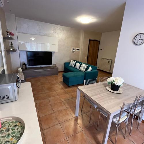 a living room with a couch and a table at Appartamento Antonietta- in Santa Maria degli Angeli