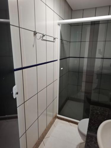 a bathroom with a shower and a toilet at Brisas do Mar HOTEL & APART in Valença