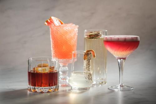 a group of different types of drinks on a table at InterContinental Indianapolis by IHG in Indianapolis