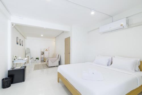 Ένα ή περισσότερα κρεβάτια σε δωμάτιο στο A Townhouse 100m from BTS Bangchak