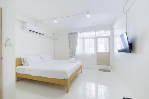 Ένα ή περισσότερα κρεβάτια σε δωμάτιο στο A Townhouse 100m from BTS Bangchak