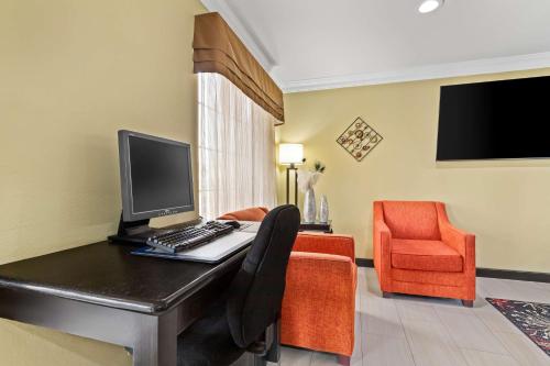 a hotel room with a desk with a computer on it at Best Western Kenosha Inn in Broken Arrow