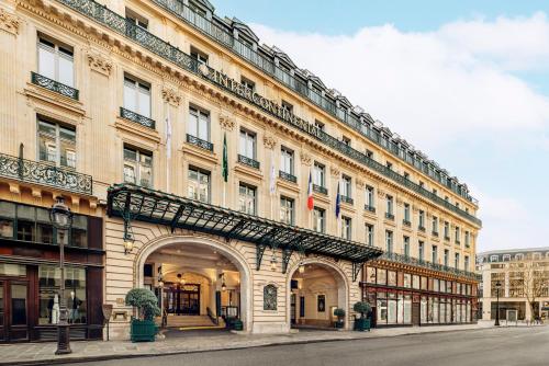 a large building with an archway in front of it at InterContinental Paris Le Grand by IHG in Paris