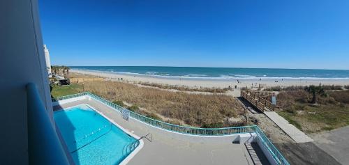 a view of a swimming pool and the beach at Southern Breeze Ocean Front Hotel in Myrtle Beach
