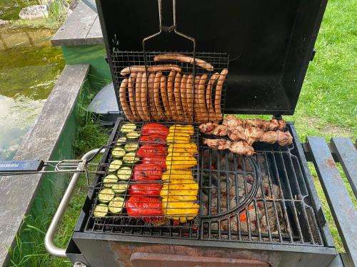 a grill with different types of food on it at Penzion Kersko in Hradišťko