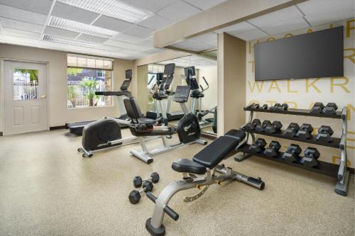 a gym with cardio equipment and a flat screen tv at Residence Inn By Marriott Las Vegas Stadium Area in Las Vegas