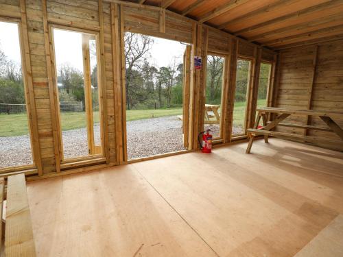 an inside view of a wooden cabin with windows at Pod 1 in St Asaph