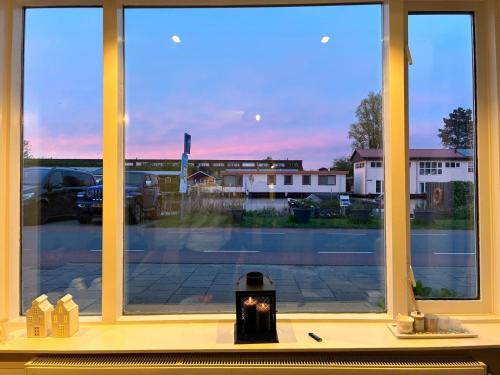 a window with a view of a parking lot at Spes Salutis in Badhoevedorp