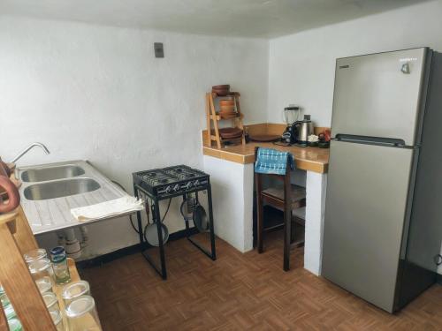 Kuchyň nebo kuchyňský kout v ubytování EL LIMÓN departamento